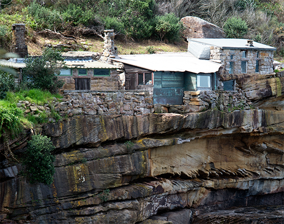 Stone huts on eastern side of Crater Cove, Sydney