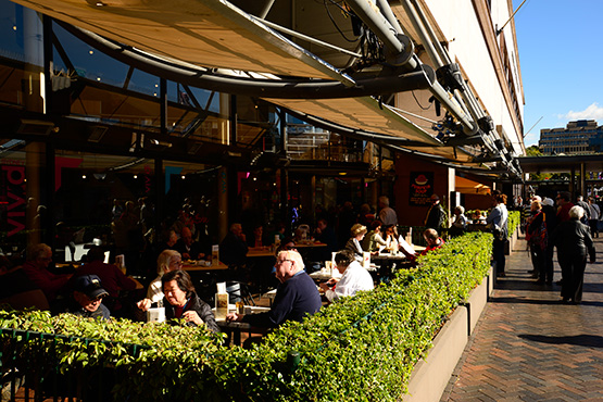 Outdoor eating areas looking out onto the wharves at Circular Quay, Sydney