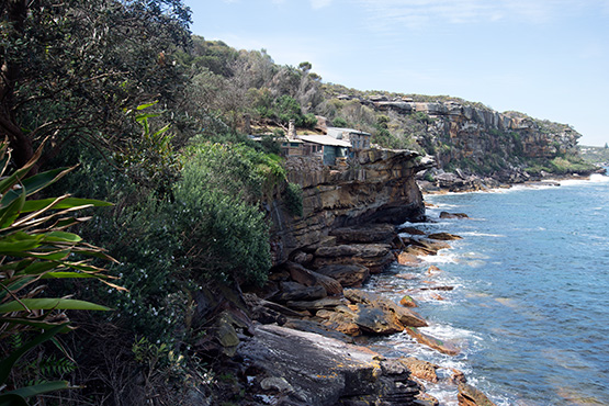 Crater Coves stone huts perch precariously on the clifftops of Dobroyd Head, Sydney