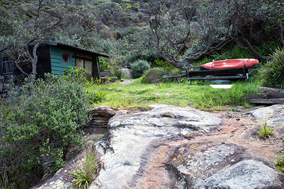 Kayac on a trailer outside a hut at Crater Cove, Sydney