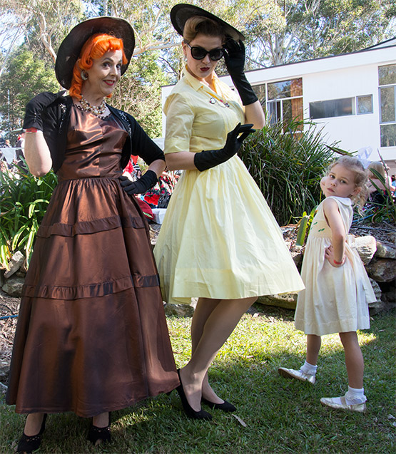Kath Clarke (Sans Souci), left, and Nicola Austin (Mosman) with a young friend at Fifties Fair, Rose Seidler House, Sydney
