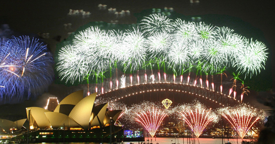 Sydney Harbour Bridge lit up with New Year's Eve fireworks